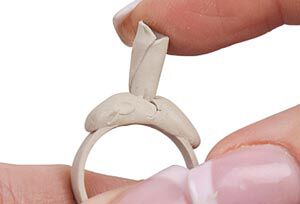 Clay cone being pressed onto ring
